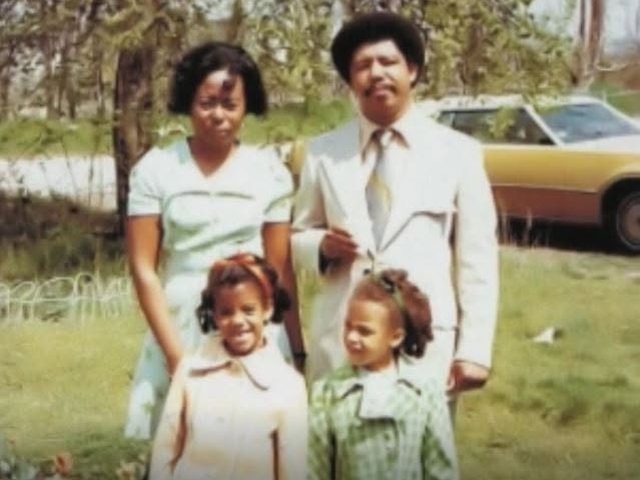 Angela and her sister with their father and stepmother, dressed for church