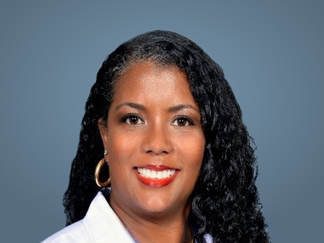 Angela's hospital portrait in her white coat