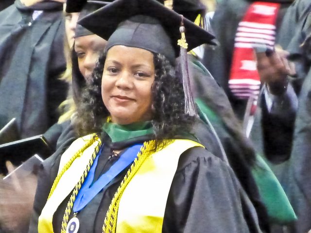 Angela at her University of Maryland Eastern Shore graduation, wearing honors cords and the Phi Kappa Phi medallion